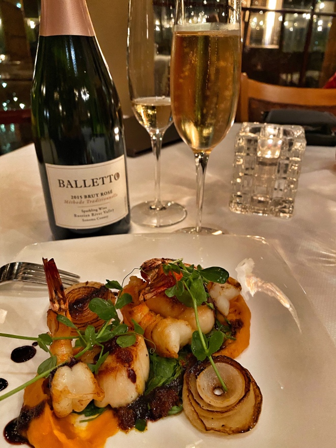 Pan Seared Diver Scallops & Gulf Prawns, paired with a local Brut 2015 Sparkling Rose 